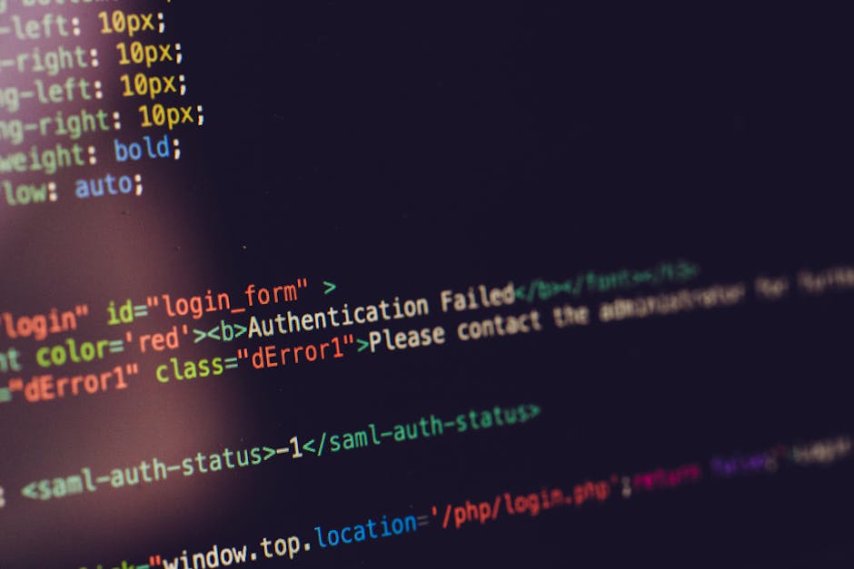 A diverse group of professionals collaborating during an office meeting, using laptops and notebooks.