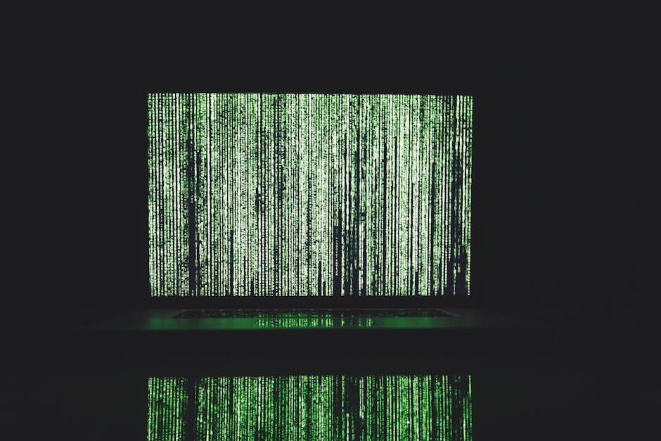 Abstract depiction of green matrix code on a computer monitor.