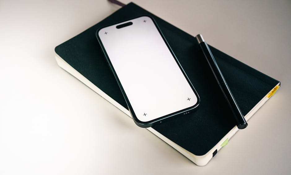 Close-up of architectural blueprints with a laptop on an office desk, showcasing design and planning.