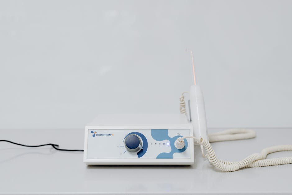 A high-tech ozone therapy device with a minimalistic design on a white background.