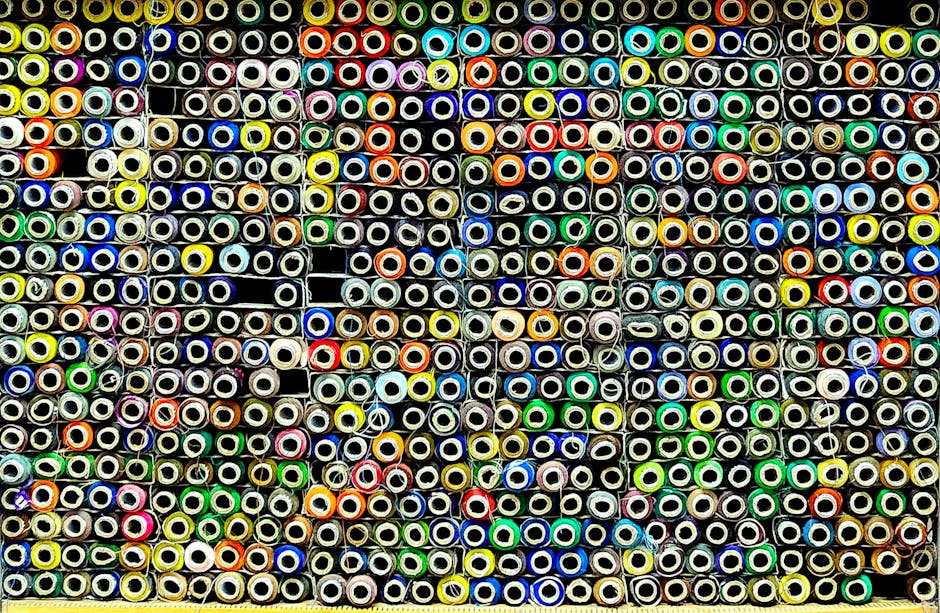 Vibrant collection of textile rolls in Rajshahi, Bangladesh, offering an abstract art pattern.