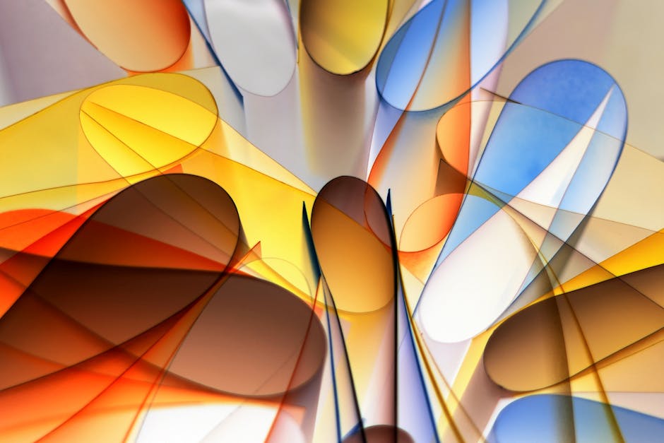A dynamic abstract image featuring vibrant shades of yellow, orange, blue, and brown forming a captivating design.