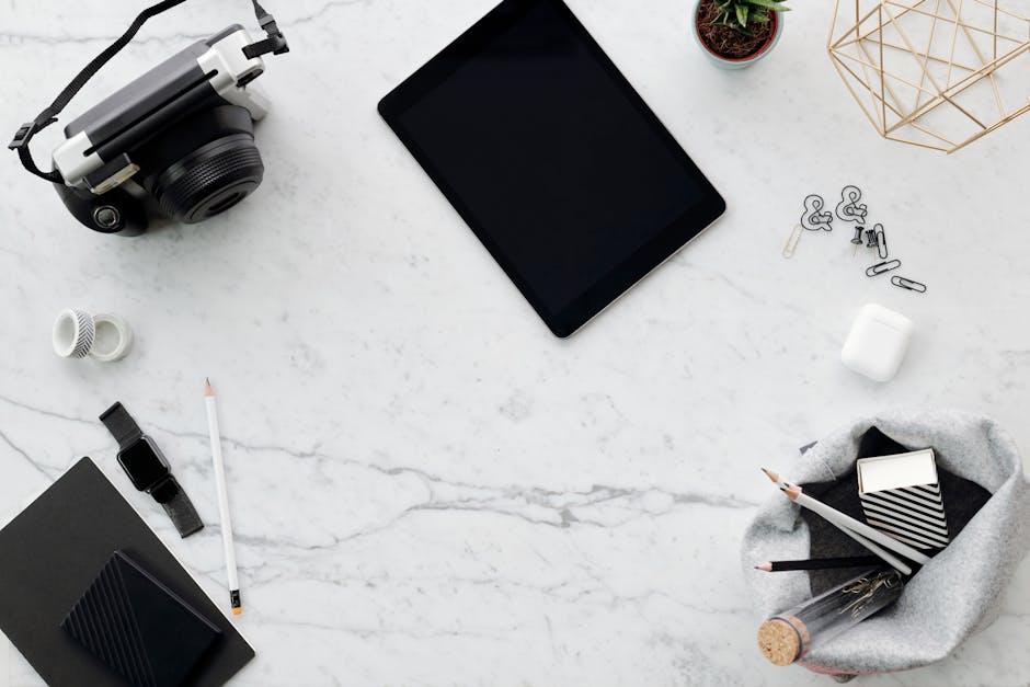 Multimedia setup featuring a laptop and a large monitor in a tech-savvy workspace.