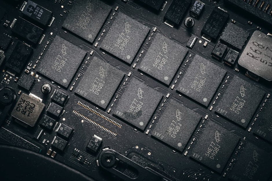 Detailed view of electronic circuit board components showcasing microchips and technology intricacies.