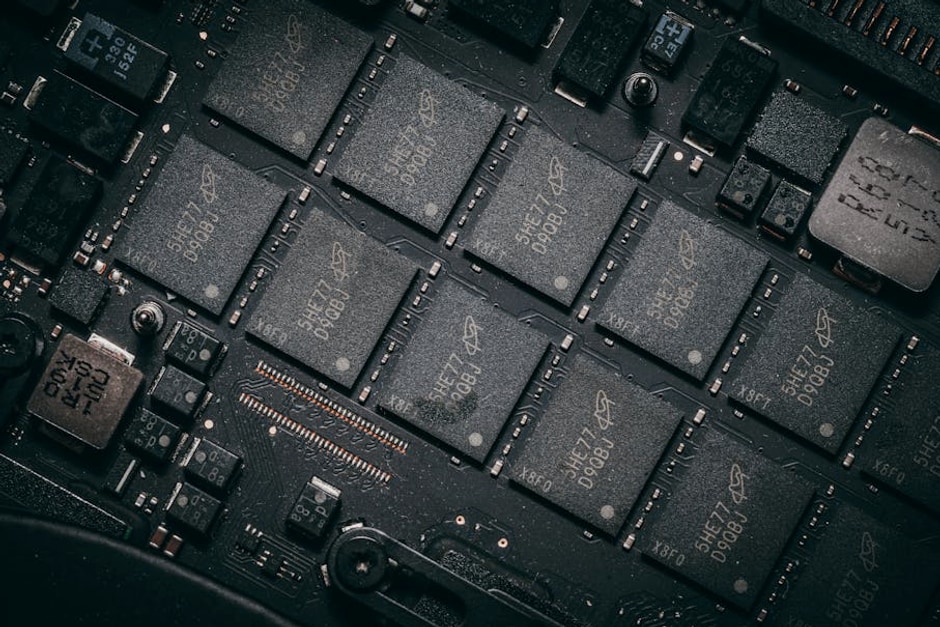 Detailed view of electronic circuit board components showcasing microchips and technology intricacies.