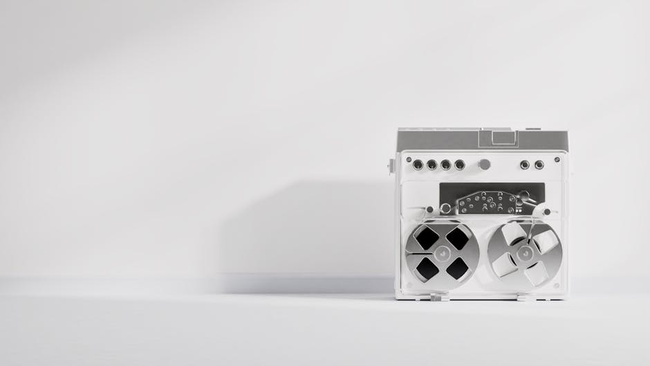 Classic reel-to-reel tape recorder in a minimalist composition with neutral tones.