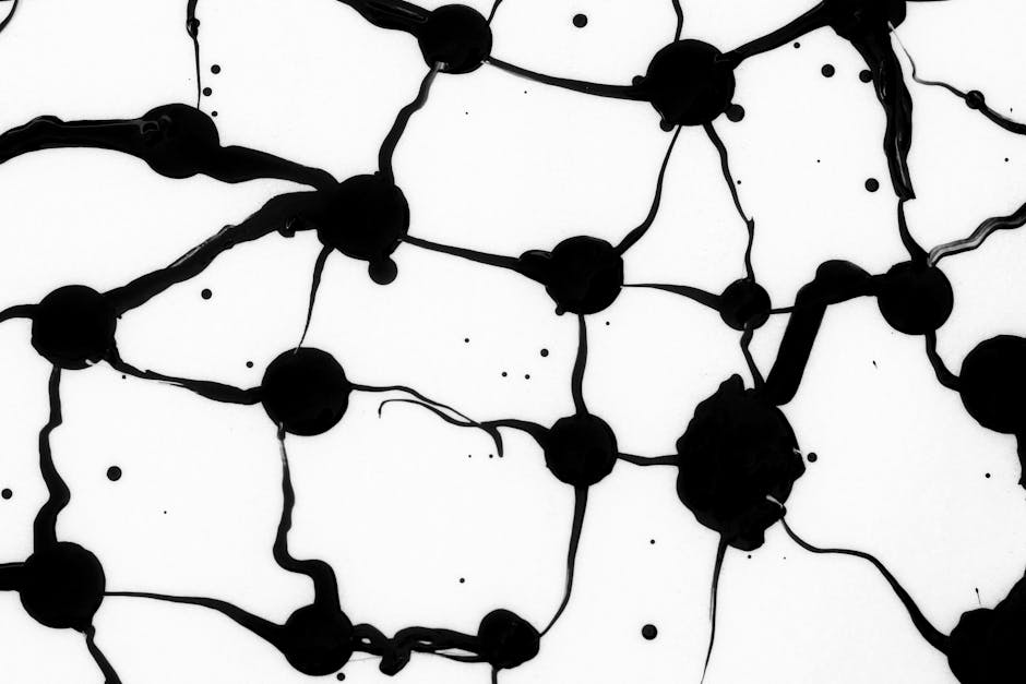 Dynamic black ink abstract pattern on white background showcasing artistic fluidity.