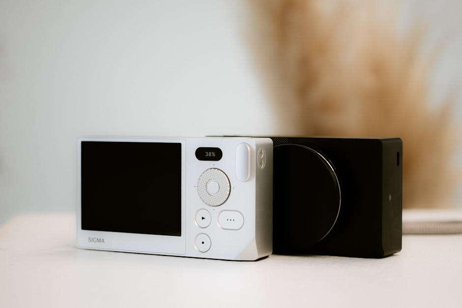 Compact Sigma camera close-up, showcasing minimalist design and modern aesthetic.