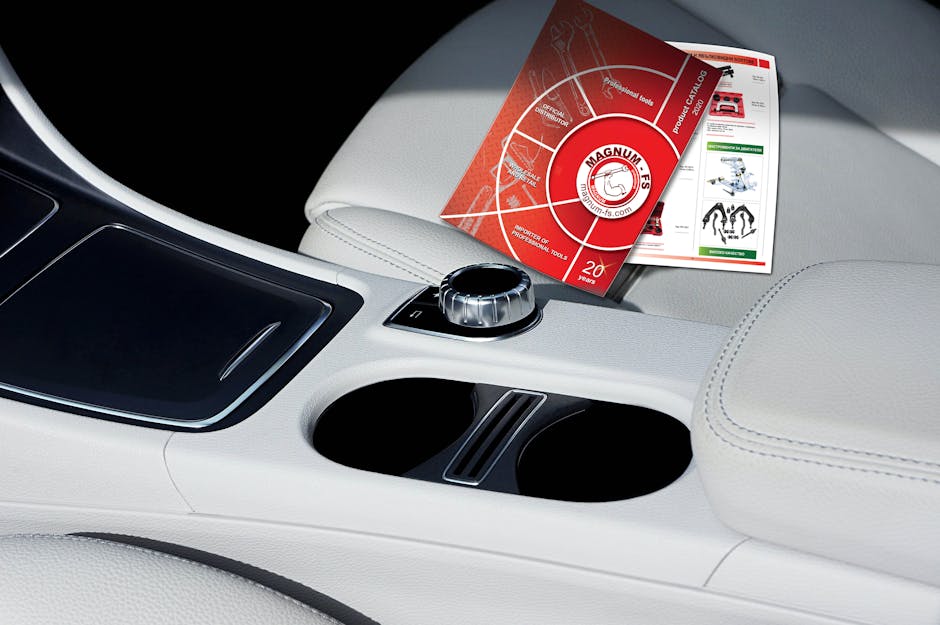 Interior of comfortable leather white automobile cabin with colorful signs on passenger seat