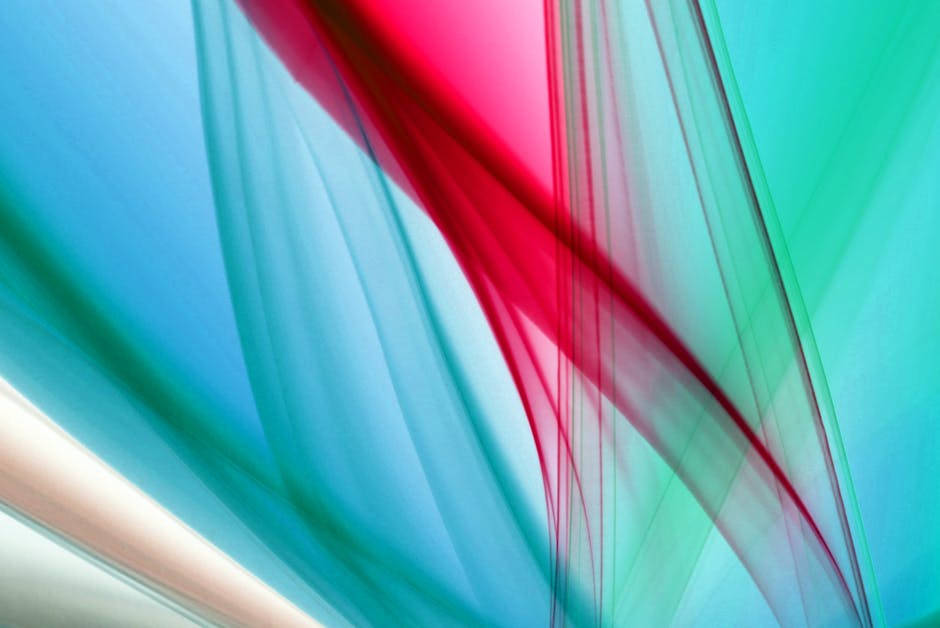 A striking abstract image featuring vivid colors and dynamic flowing shapes.